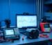 Electrical engineer workspace showing tools and software for servo drive sizing and motion control calculation.