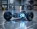 Technical 3D render of an AMR chassis showing a precision wheel drivetrain and steering module.