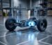 Technical 3D render of an AMR chassis showing a precision wheel drivetrain and steering module.